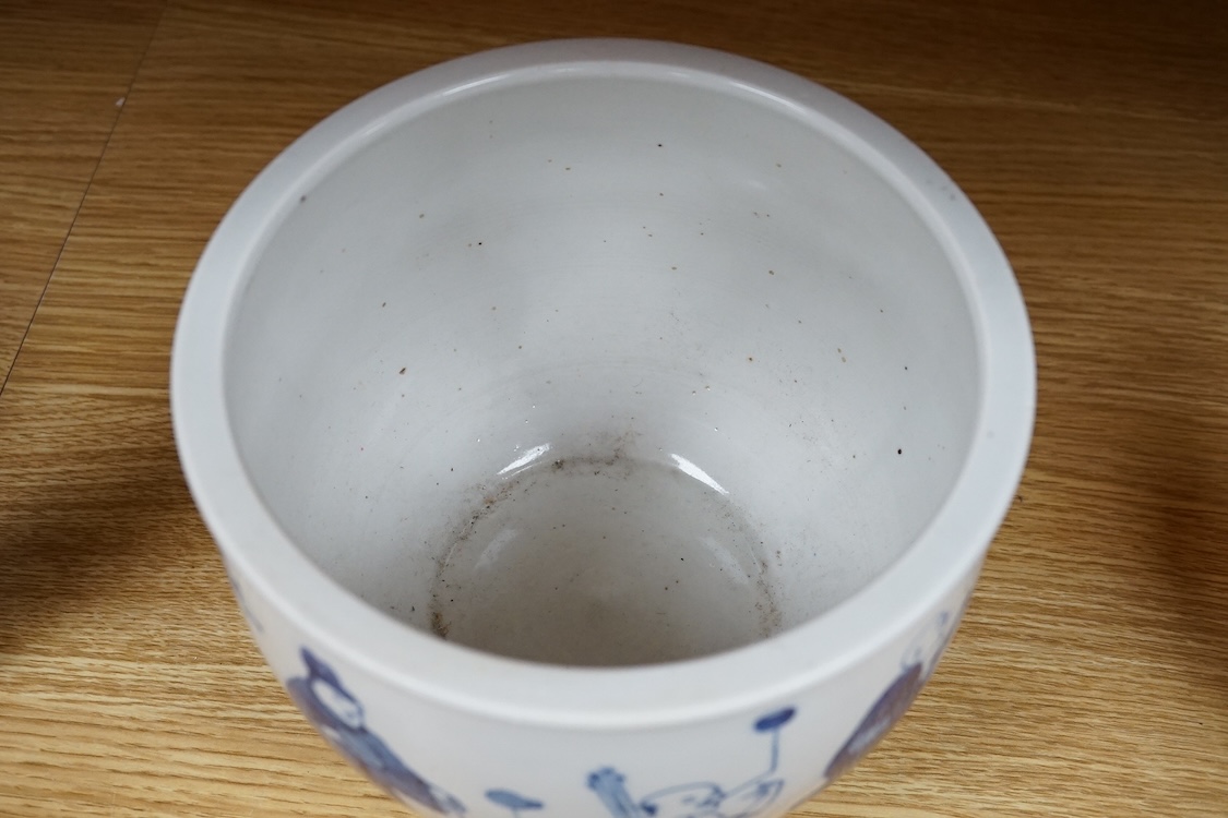 A small Chinese blue and white jardiniere painted with figures at various pursuits, 19cm in diameter